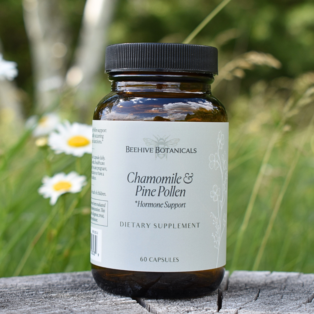 Bottle of Beehive Botanicals Chamomile & Pine Pollen supplement with a natural background