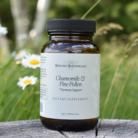 Bottle of Beehive Botanicals Chamomile & Pine Pollen supplement with a natural background