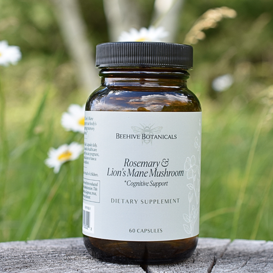 Rosemary & Lion's Mane Mushroom Bottle of Beehive Botanicals dietary supplement with a natural background